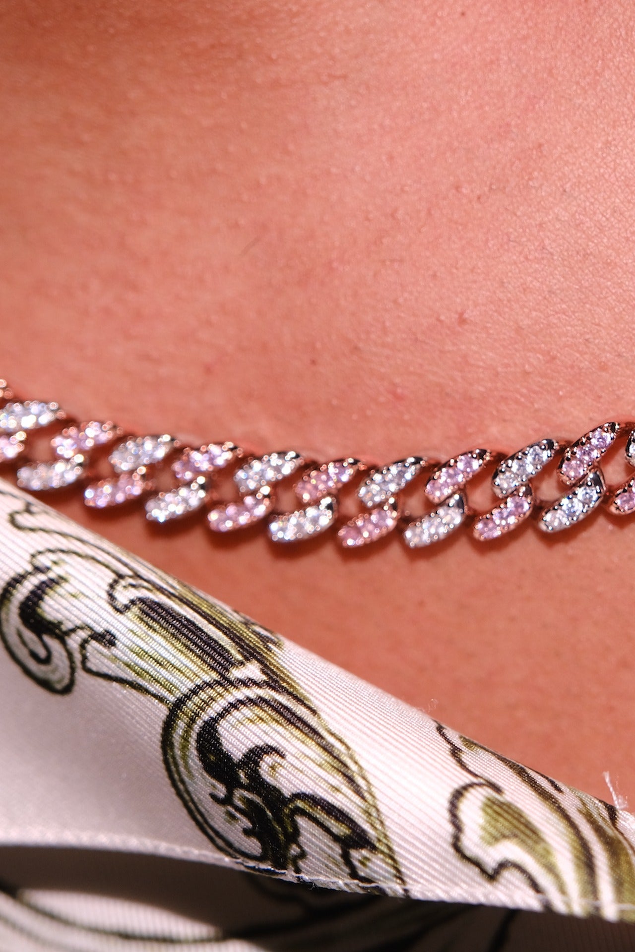 Owner's Two Tone Pink chain styled with a silk scarf