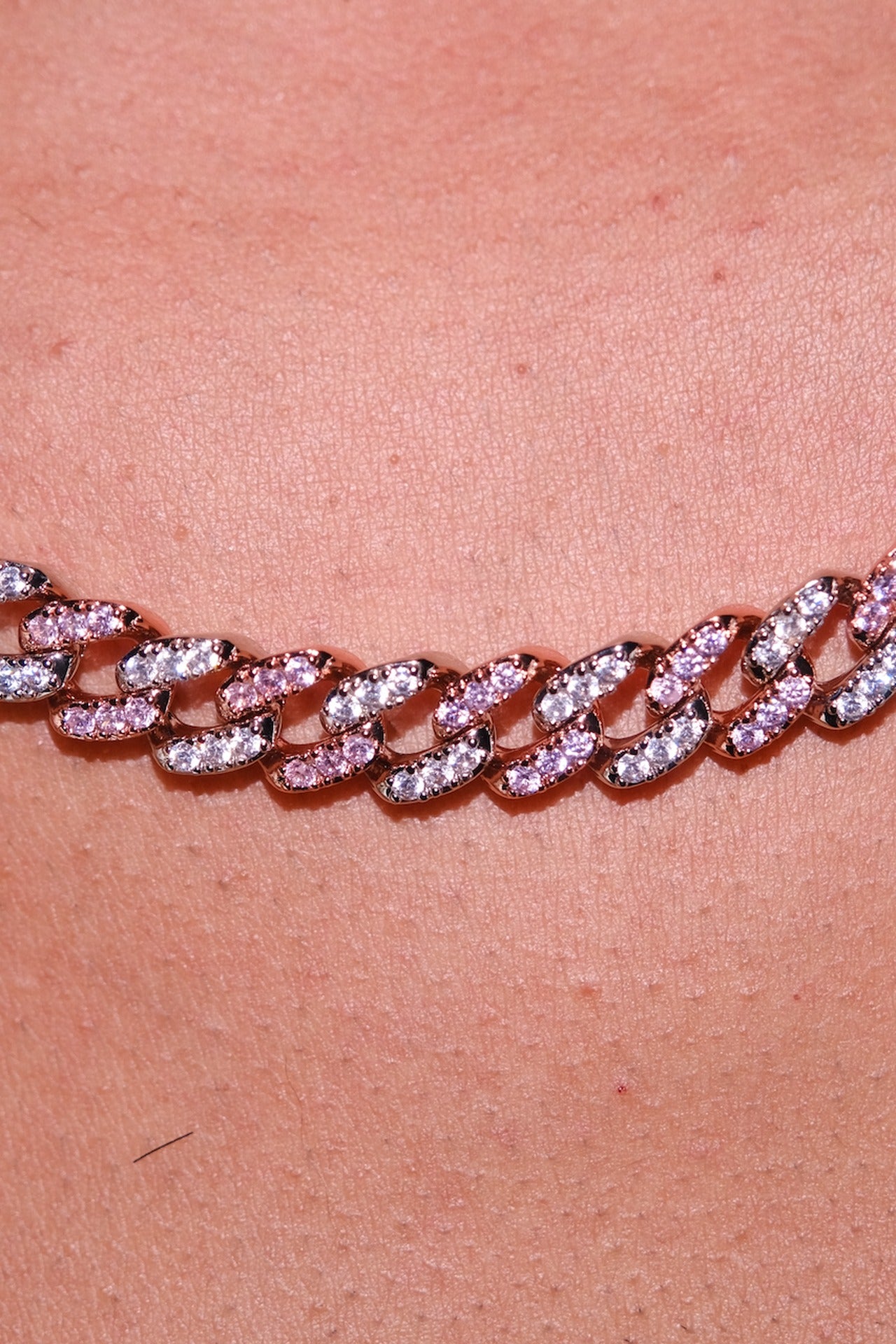 Owner's Two Tone Pink chain worn, pink and clear cubic zirconia in rose-tone links